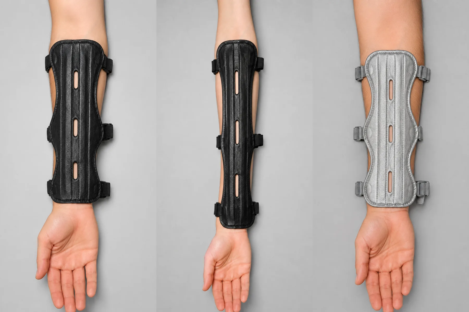 Three forearms of different lengths, each wearing a differently sized arm guard, black, long black and silver grey